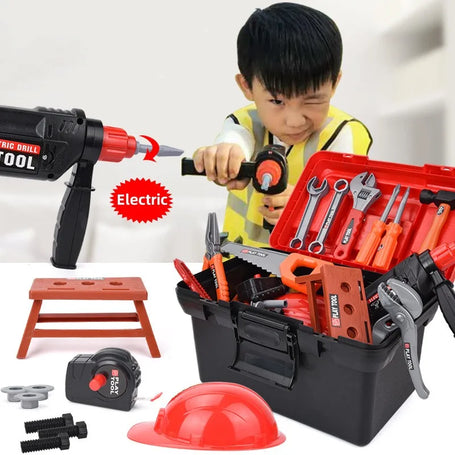 Child wearing a safety vest and helmet, holding a red toy power drill while playing with a toy toolbox filled with wrenches, pliers, and other tools.