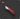 Red pocket knife on a dark background
