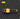 Yellow grill brush with black bristles on a dark background