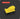 A bright yellow rectangular foam-like sponge or pad shown on a dark gray background with subtle concentric circular lines. A red label at top left reads “SQUARE 2.