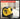 Yellow tape measure with text about precision accuracy on a blurred room background