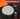 Precision locking dial with unlock and lock labels on a black and orange background