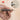 Close-up of the Profila Tools center punch being used to precisely drive a small nail into a wooden surface. Inset image shows a zoomed-in view of the nail being set