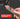 Hand holding a tool with an orange handle, labeled 'Perfect Contour in Seconds', on a dark background.