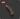 Retractable knife with orange handle on a dark background