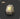Khaki-colored light source on a dark background