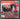 Red and black tool set with drill and toolbox on a gray background, featuring text about tool set characteristics.